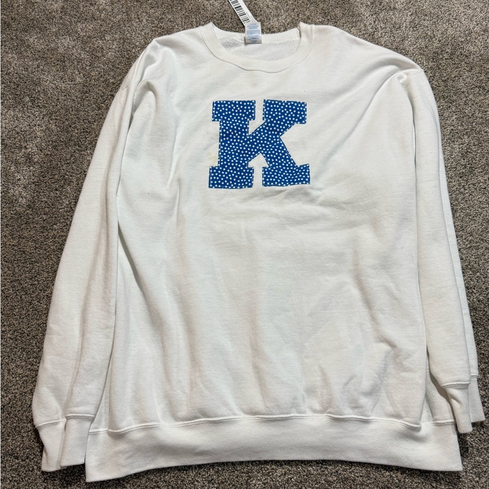 White Sweater with Blue Lettering